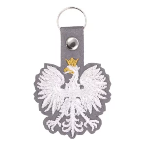 Élégant pendentif en forme d'aigle polonais, finement détaillé, suspendu à une chaîne, symbolisant la fierté et l'héritage polonais.